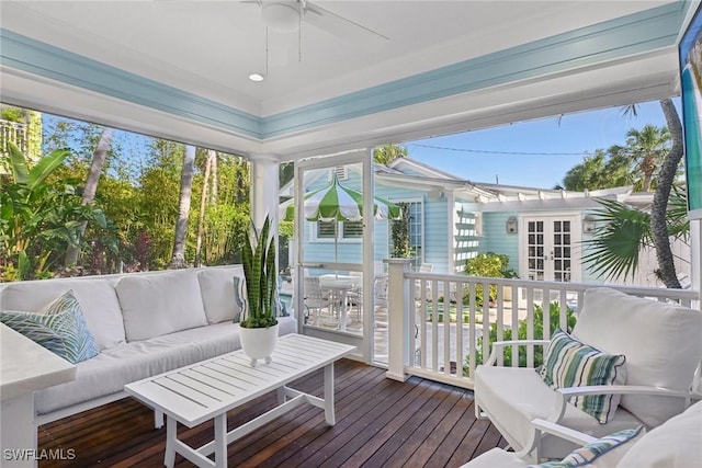 sunroom / solarium with ceiling fan