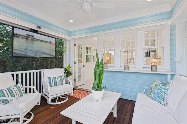 sunroom with a ceiling fan