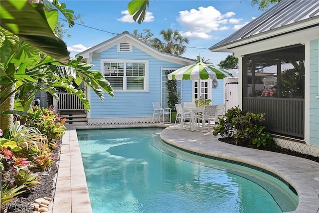 outdoor pool with a patio