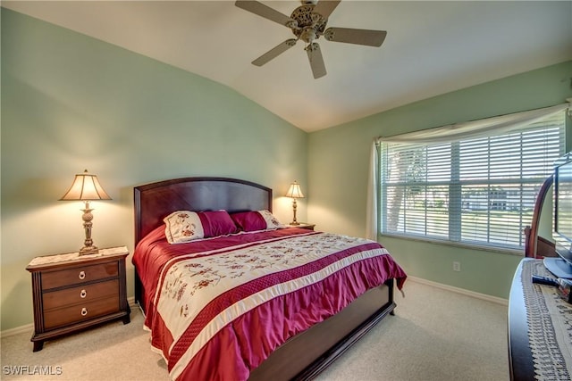 bedroom featuring lofted ceiling, carpet flooring, baseboards, and ceiling fan