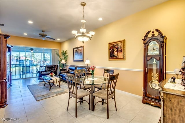 dining area with recessed lighting, baseboards, light tile patterned floors, and ceiling fan with notable chandelier