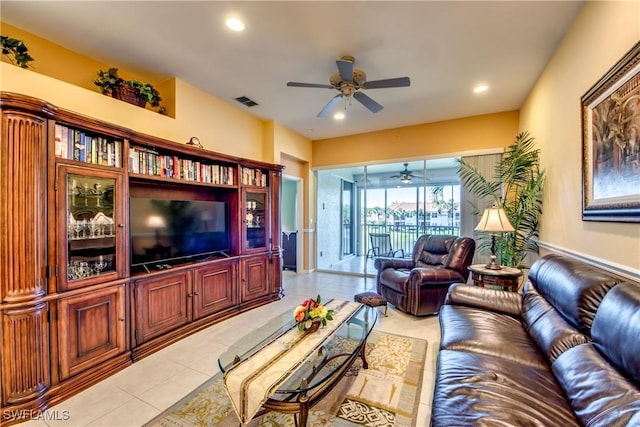 living area featuring light tile patterned floors, recessed lighting, visible vents, and ceiling fan