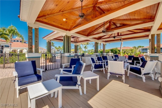 deck with a gazebo and a ceiling fan