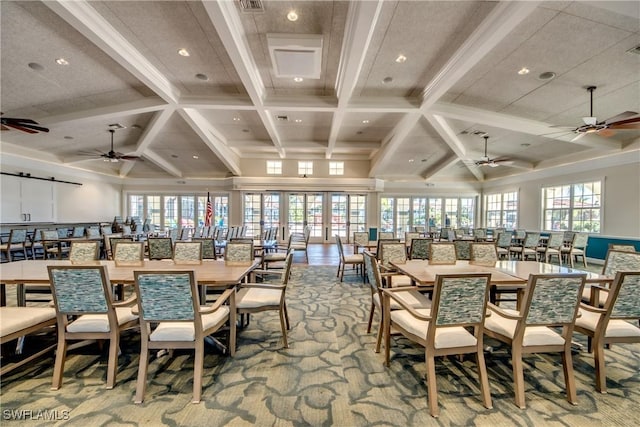 dining room featuring beam ceiling, coffered ceiling, and a wealth of natural light