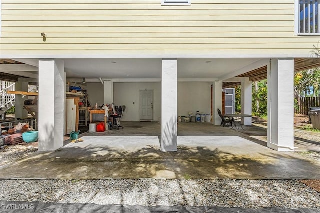 garage featuring a carport