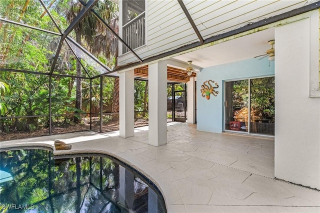 pool featuring a patio, a ceiling fan, and a lanai