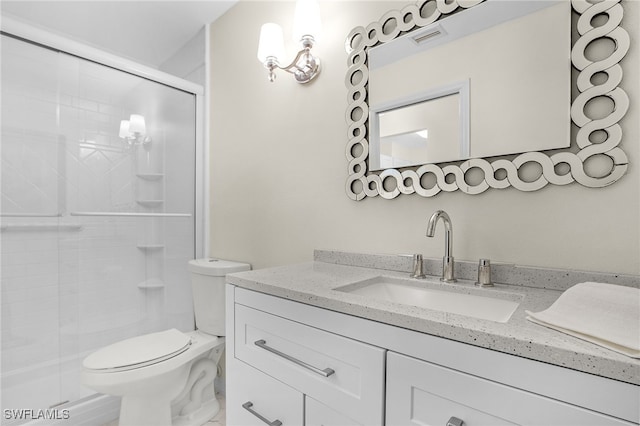 full bathroom with visible vents, a shower stall, toilet, and vanity