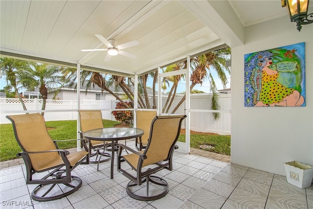 sunroom / solarium with wood ceiling and ceiling fan