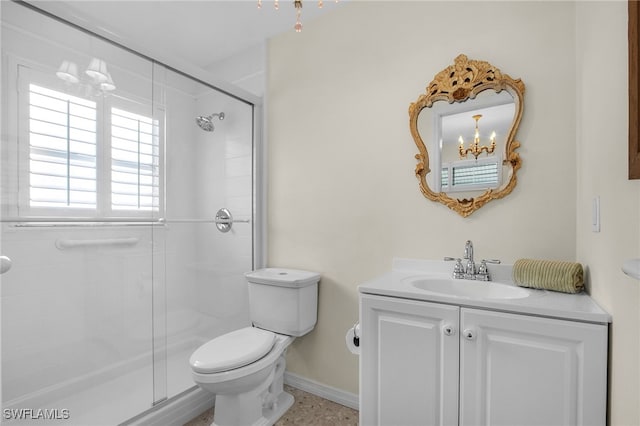 full bathroom with vanity, baseboards, a shower stall, toilet, and a chandelier