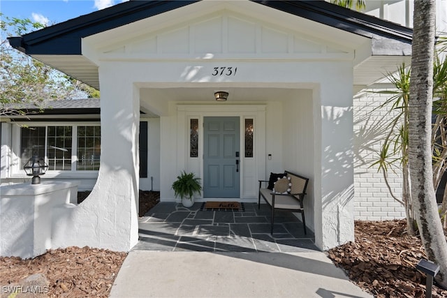 doorway to property with board and batten siding