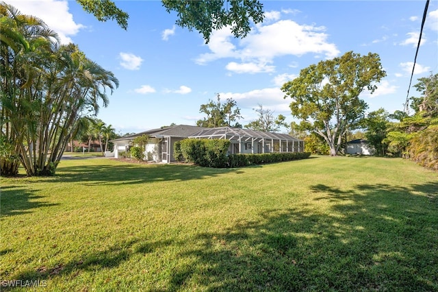 view of yard featuring glass enclosure