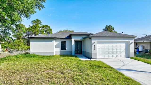 2810 64th St W, Lehigh Acres, FL 33971 - view of front of home with a front yard, concrete driveway, stucco siding, central AC unit, and a garage