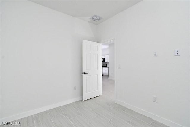 2810 64th St W, Lehigh Acres, FL 33971 - unfurnished room with baseboards and visible vents