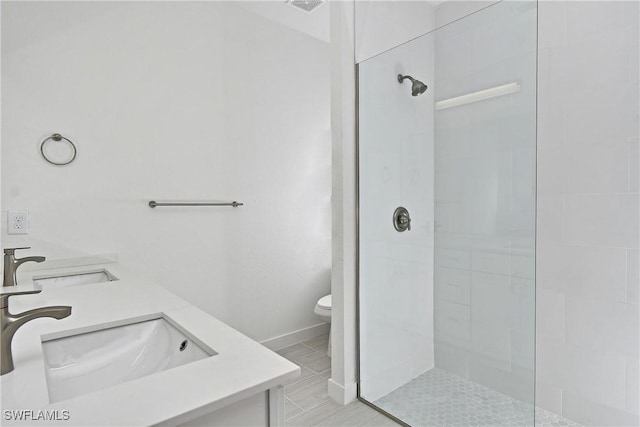 2810 64th St W, Lehigh Acres, FL 33971 - bathroom with toilet, a sink, double vanity, and a walk in shower