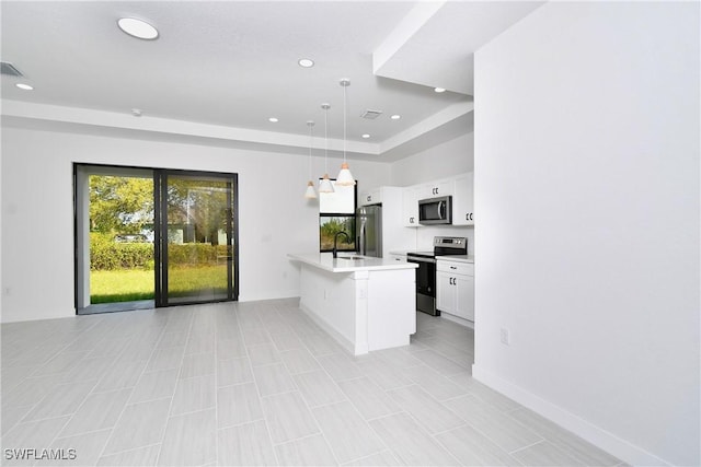 2810 64th St W, Lehigh Acres, FL 33971 - kitchen with light countertops, white cabinets, recessed lighting, appliances with stainless steel finishes, and decorative light fixtures