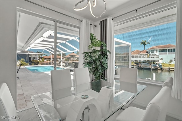 dining room featuring a sunroom