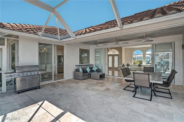 view of patio / terrace featuring a ceiling fan, area for grilling, french doors, a lanai, and an outdoor hangout area