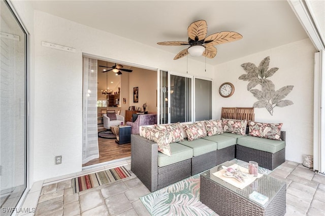 interior space featuring ceiling fan and outdoor lounge area