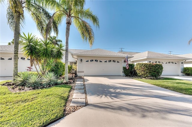 view of front of property featuring stucco siding and driveway