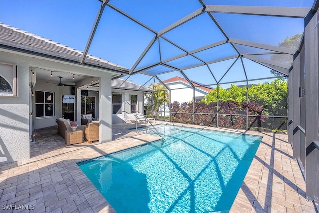 pool with an outdoor hangout area, a lanai, a ceiling fan, and a patio area