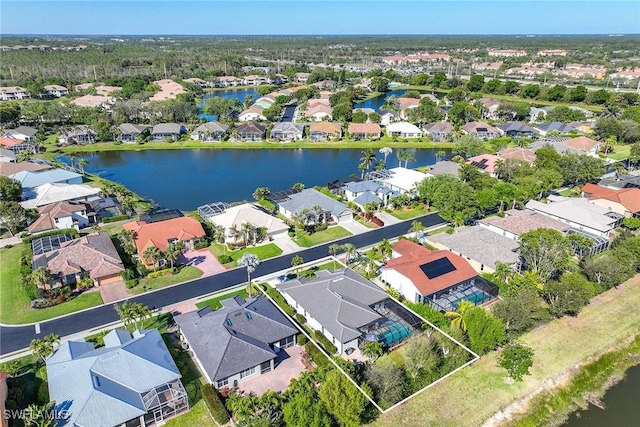 birds eye view of property with a residential view and a water view