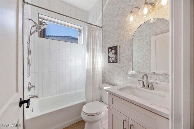 bathroom with vanity, shower / tub combo, and toilet