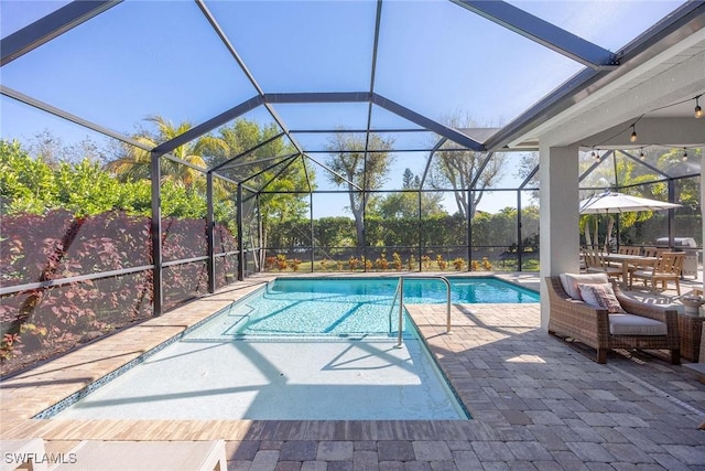 pool featuring a patio area and glass enclosure