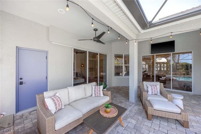 view of patio / terrace with an outdoor living space and a ceiling fan