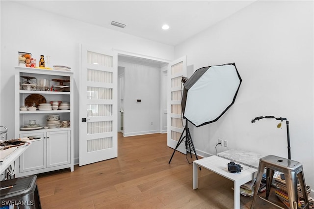 interior space featuring recessed lighting, visible vents, light wood-style flooring, and baseboards