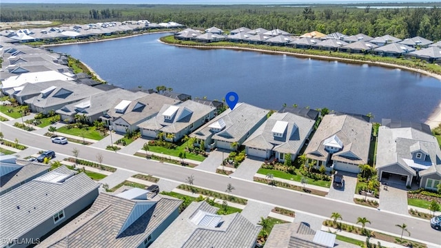 bird's eye view with a residential view and a water view