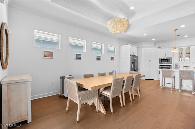 dining room featuring recessed lighting, light wood-style floors, baseboards, and a chandelier