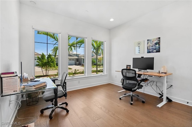 office area with recessed lighting, baseboards, and wood finished floors