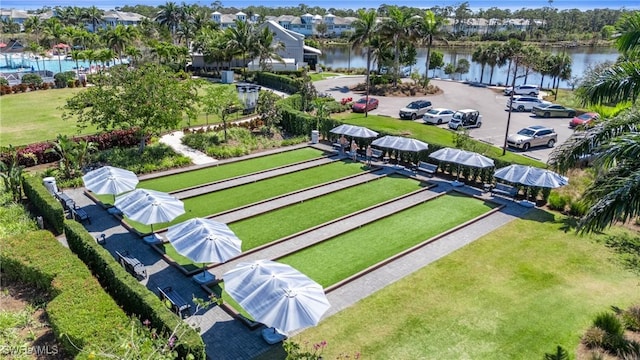 birds eye view of property with a water view