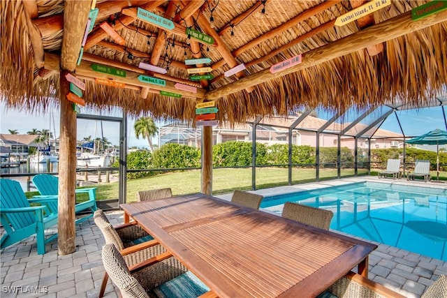 pool featuring a gazebo, a yard, a patio, and a lanai