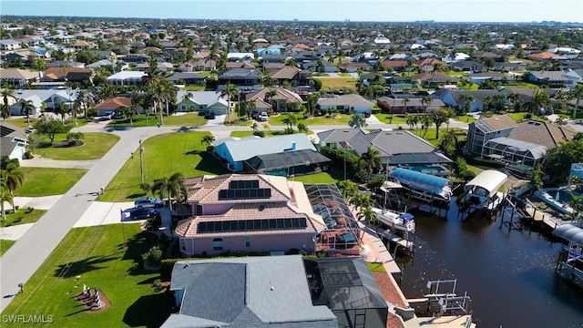 bird's eye view featuring a residential view and a water view