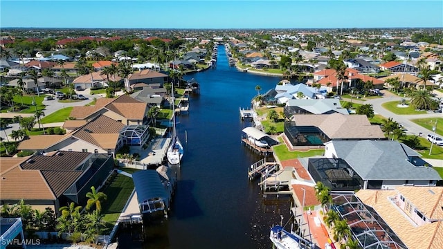aerial view featuring a residential view and a water view