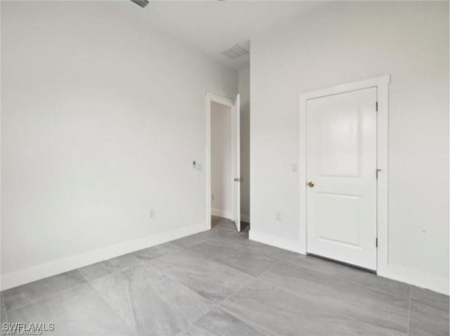 unfurnished bedroom with baseboards