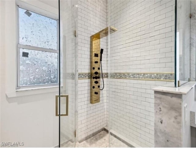 bathroom with tiled shower