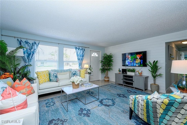 living area featuring a textured ceiling