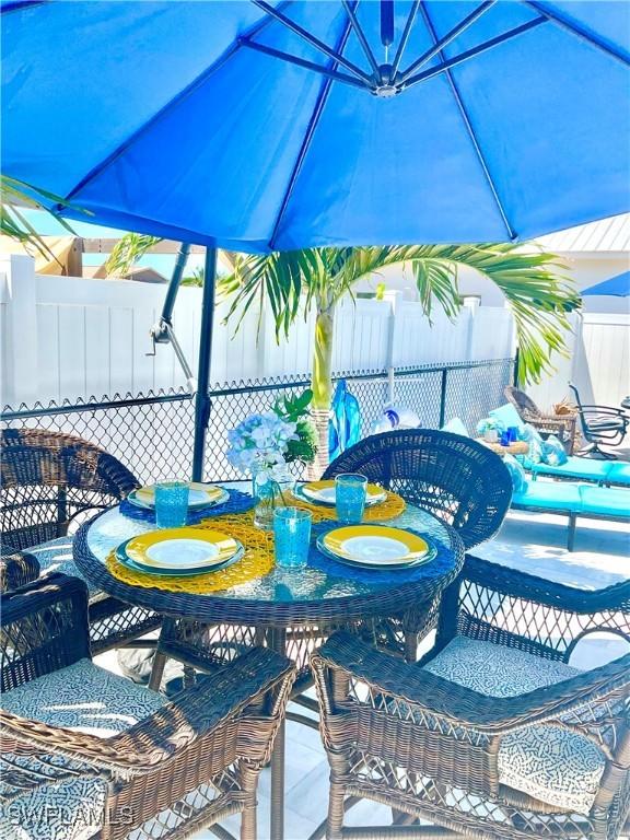 view of patio / terrace featuring fence