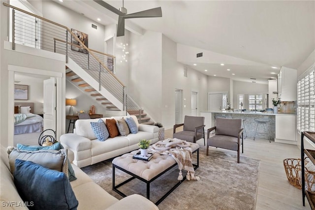 1590 Weybridge Cir Unit 52, Naples, FL 34110 - living room featuring high vaulted ceiling, recessed lighting, stairs, light wood-style floors, and a ceiling fan