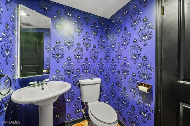 3775 27th Ave SW, Naples, FL 34117 - bathroom with toilet and wallpapered walls