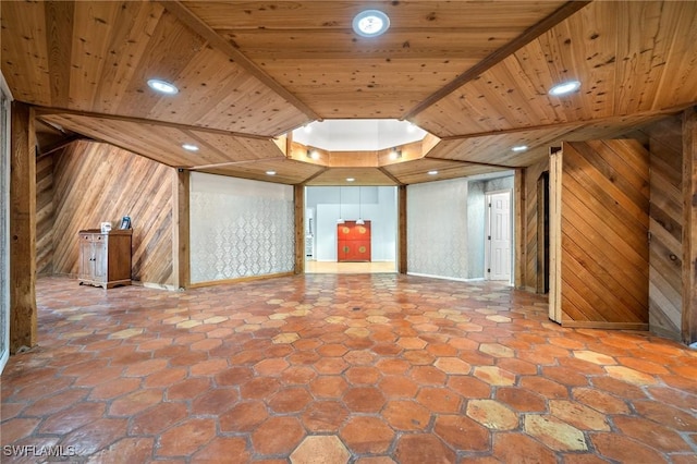 3775 27th Ave SW, Naples, FL 34117 - unfurnished living room with wooden walls, wooden ceiling, recessed lighting, and a tray ceiling