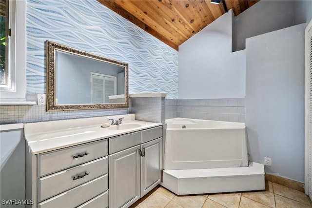 3775 27th Ave SW, Naples, FL 34117 - bathroom with wooden ceiling, wallpapered walls, lofted ceiling, tile patterned floors, and a garden tub