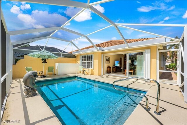 4221 Saint George Ln, Naples, FL 34119 - outdoor pool with glass enclosure and a patio area
