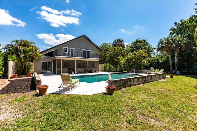 183 Old Tamiami Trl, Naples, FL 34110 - swimming pool featuring a sunroom, a patio, and a yard