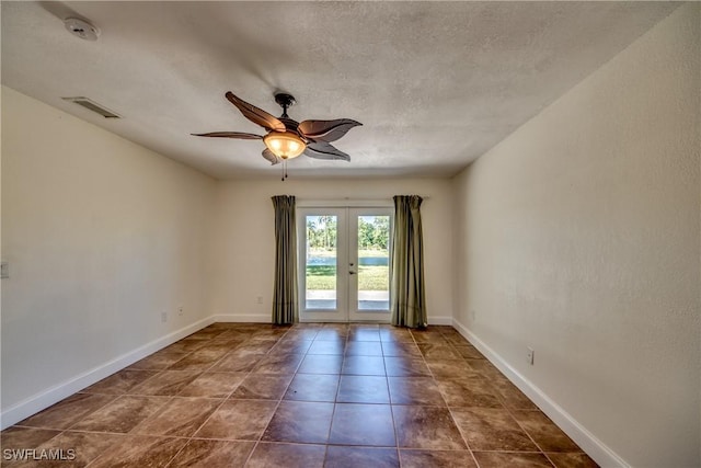 17225 Castleview Dr, North Fort Myers, FL 33917 - unfurnished room featuring a textured ceiling, visible vents, baseboards, ceiling fan, and french doors