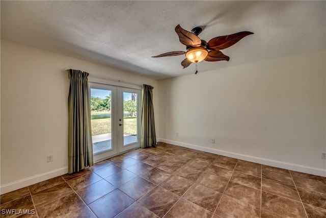 17225 Castleview Dr, North Fort Myers, FL 33917 - empty room with french doors, a ceiling fan, baseboards, and a textured ceiling