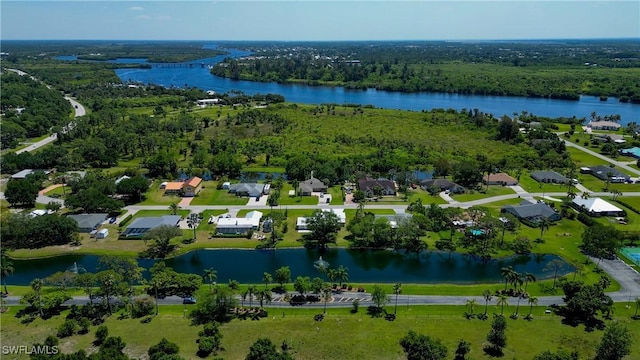 17225 Castleview Dr, North Fort Myers, FL 33917 - drone / aerial view featuring a residential view, a water view, and a wooded view