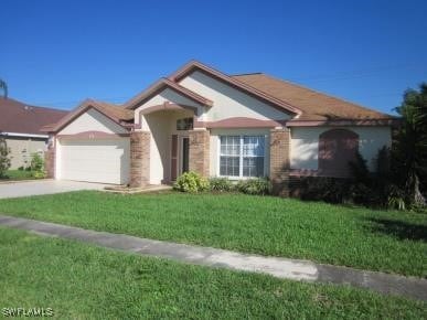 4556 Varsity Cir, Lehigh Acres, FL 33971 - ranch-style house with an attached garage, a front lawn, driveway, and stucco siding